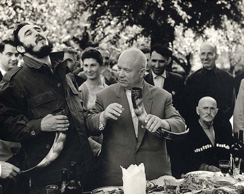 Fidel Castro and Nikita Khrushchev drinking wine from a drinking horn in the Soviet Republic of Georgia, 1963