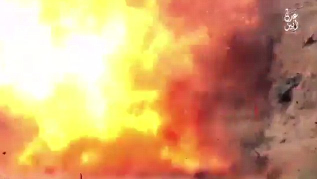 Explosion: One video, shared by an ISIS supporter, shows the men being obliterated when the mortar shells around their necks are detonated