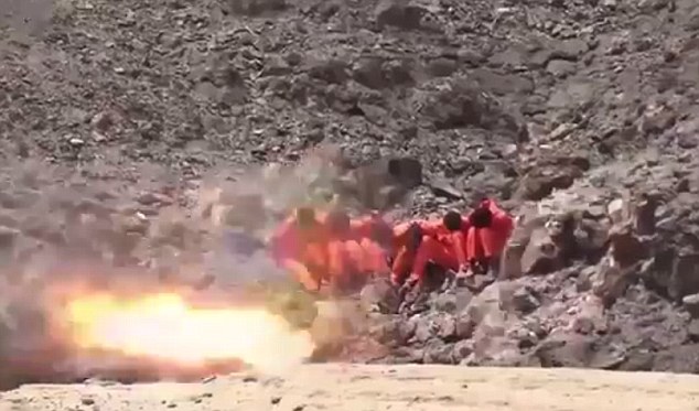 Barbaric: In another sickening execution video, six men sitting on a rocky hill were blown up by a rocket launcher
